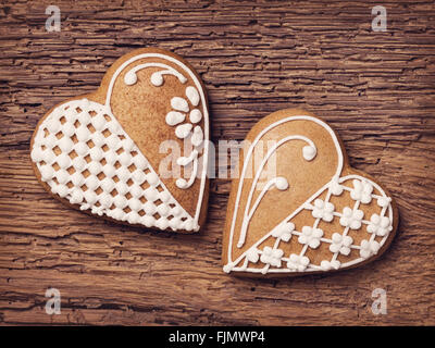 Gingerbread heart cookies on a wooden brown background Stock Photo