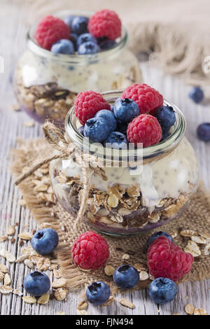 Chia seeds pudding with raspberries and blueberries Stock Photo