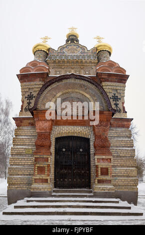 Bridge leading to the Peter and Paul Cathedral and chapel-tomb of Paskevich in city park in Gomel, Belarus. Winter season Stock Photo