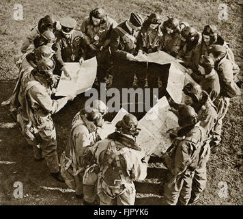 Air cadets ,c.  1940. WWII  at an air force training camp.  Pilots learning to take instructions and study maps before setting out on a flight.. Stock Photo