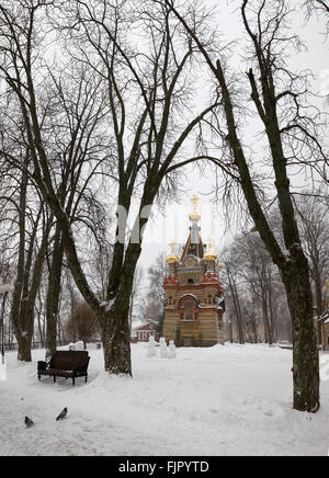 Bridge leading to the Peter and Paul Cathedral and chapel-tomb of Paskevich in city park in Gomel, Belarus. Winter season Stock Photo