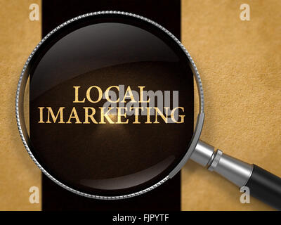 Local IMarketing Concept through Magnifier. Stock Photo