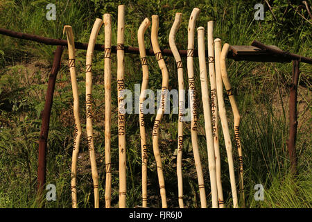 Walking sticks, canes, for sale buy honesty box on mountain footpath, Drakensberg Park South Africa. Stock Photo