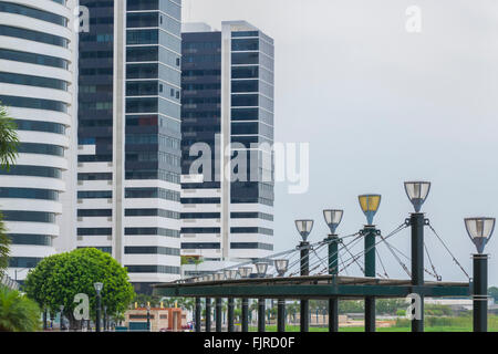 Modern buildings and boardwalk at the front of guayas river at Puerto Santa Ana in Guayquil, Ecuador. Stock Photo