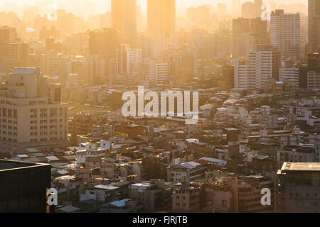 View of buildings in haze at sunset, from Elephant Mountain, in Taipei, Taiwan. Stock Photo