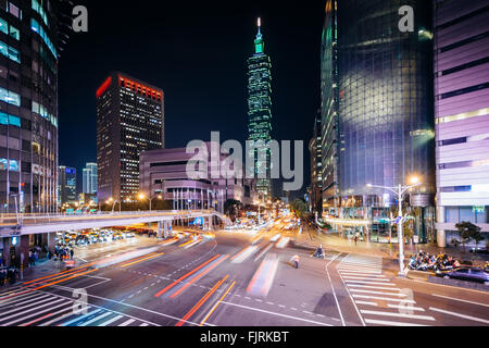 Traffic on Xinyi Road and view of Taipei 101 at night, in Taipei, Taiwan. Stock Photo