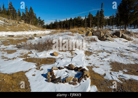 Camp Fire Rock Circle In Snow Stock Photo