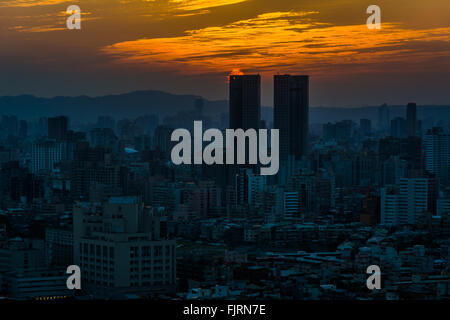 Sunset over buildings in Taipei from Elephant Mountain, in Taipei, Taiwan. Stock Photo