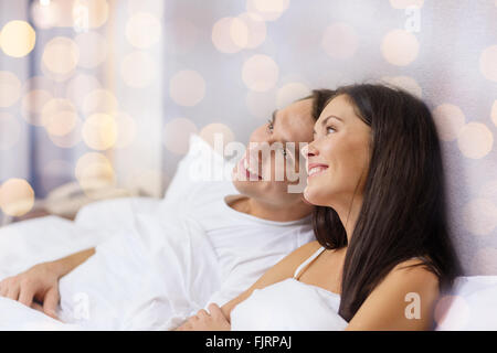 happy couple dreaming in bed Stock Photo