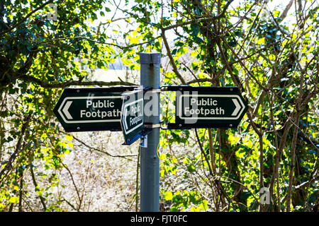 public footpath sign metal post green signs UK England rural Stock Photo