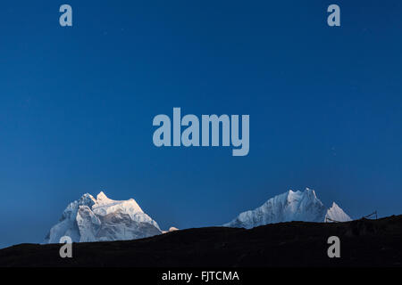 Kangtega and Thamserku peaks at dusk. Sagarmatha National Park. Solukhumbu District. Nepal. Stock Photo