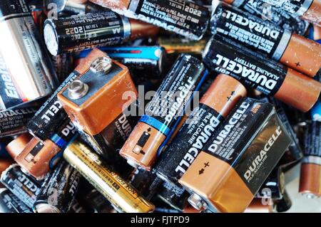 Recycling alkaline household batteries to preserve the environment Stock Photo