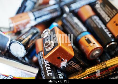 Recycling alkaline household batteries to preserve the environment Stock Photo