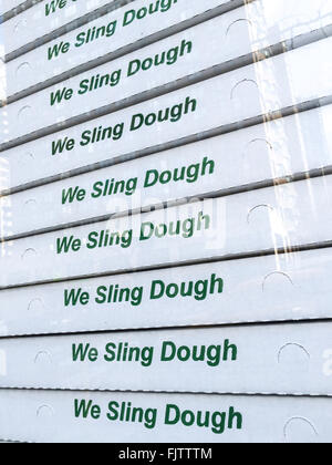 "We Sling Dough" Printed on Stacked Pizza Boxes, USA Stock Photo