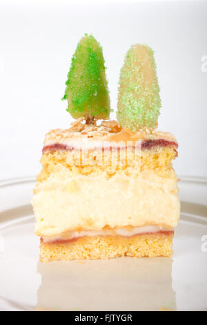 Cream cake with marzipan trees Stock Photo
