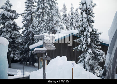 Ice Hotel Sweden entrance wooden sign with snow. Stock Photo