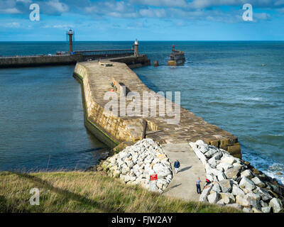 Whitby Harbour mouth from above the East Pier on a sunny winters day Stock Photo