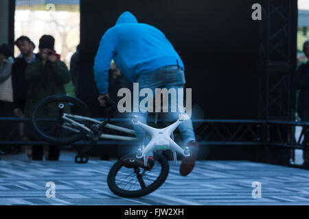 Tokyo, Japan. 3rd March, 2016. The new generation Phantom 4 that can dodge obstacles and track performs during a media event in Roppongi Hills on March 3, 2016, Tokyo, Japan. DJI's new model integrates a set of stereo cameras and proximity sensors that work with a computer software vision, which allows the Phantom 4 to fly autonomously. The new generation drone includes two newly added features, the ActiveTrack to continuously record a moving object and TapFly that allows users to select waypoints by controlling their smartphone or tablet. Credit:  Aflo Co. Ltd./Alamy Live News Stock Photo