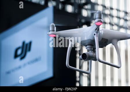 Tokyo, Japan. 3rd March, 2016. The new generation Phantom 4 that can dodge obstacles and track performs during a media event in Roppongi Hills on March 3, 2016, Tokyo, Japan. DJI's new model integrates a set of stereo cameras and proximity sensors that work with a computer software vision, which allows the Phantom 4 to fly autonomously. The new generation drone includes two newly added features, the ActiveTrack to continuously record a moving object and TapFly that allows users to select waypoints by controlling their smartphone or tablet. Credit:  Aflo Co. Ltd./Alamy Live News Stock Photo