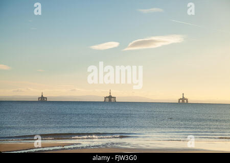 Three oil rigs sitting in the Firth of Forth near Edinburgh because of a down turn in oil production. Stock Photo