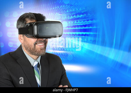 Mature businessman using virtual reality glasses over abstract background Stock Photo