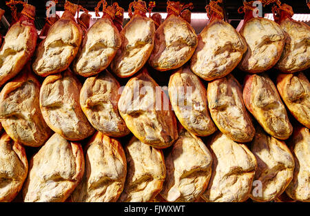 Jamon serrano ham from Spain whole in a row Iberico Stock Photo