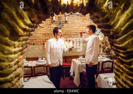 Sobrino de Botin restaurant, waiters, testing the wine, calle Cuchilleros 17. Madrid, Spain. Stock Photo