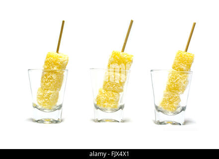 steam tapioca square ball with coconut fuzz, traditional Thai snack skewer in glassware isolated on white background Stock Photo