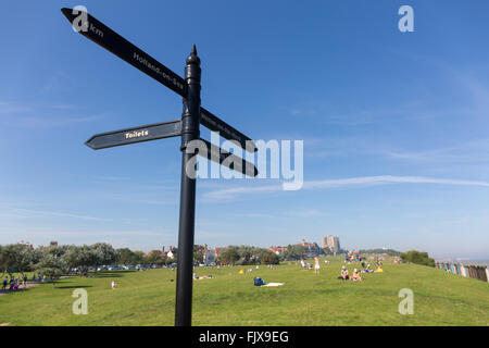 Signpost on the Greensward at Frinton-on-Sea, Essex UK Stock Photo