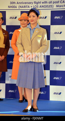 Narita, Japan. 3rd Mar, 2016. A cabin attendant of Japanese airline All Nippon Airways (ANA) wears uniform of their sixth generation before her flight to Los Angels to celebrate ANA's 30th anniversary to launch regular service of international flight at the Narita airpport in Narita city, suburban Tokyo on Thursday, March 3, 2016. Cabin attendants for the commemorated flight are in srevice with their first to 10th generation uniforms. © Yoshio Tsunoda/AFLO/Alamy Live News Stock Photo