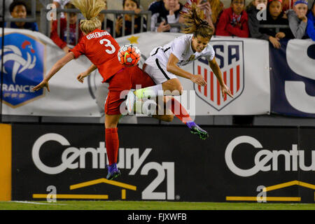 Tampa, Florida, USA. 3rd Mar, 2016. England defender ALEX GREENWOOD (3) and US midfielder TOBIN HEATH (17) go airborne for a ball during the She Believes Cup at Raymond James Stadium. USA Women Beat England 1-0. © Scott A. Miller/ZUMA Wire/Alamy Live News Stock Photo