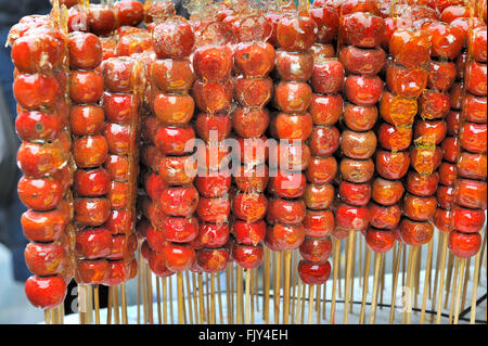 Tanghulu, also called bing tanghulu, is a traditional winter snack in northern China, especially in Beijing. It has a hardened s Stock Photo