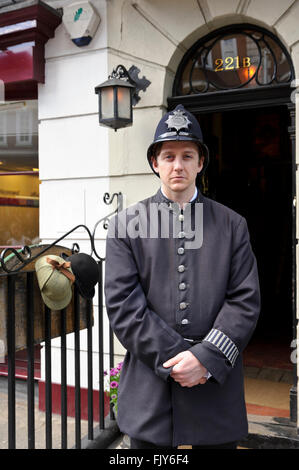 A man dressed in Police uniform outside the Sherlock Holmes Museum in Baker Street, London, United Kingdom. Stock Photo