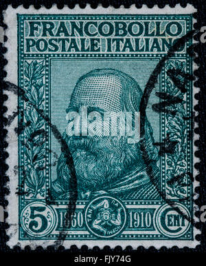 1910 - Old postage stamp used of the Kingdom of Italy  Garibaldi effige -  5 c. Stock Photo