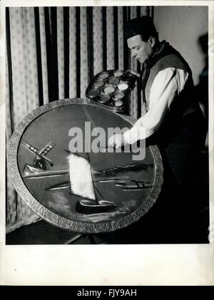 A table covered with a white cloth holds various platters and bowls of ...
