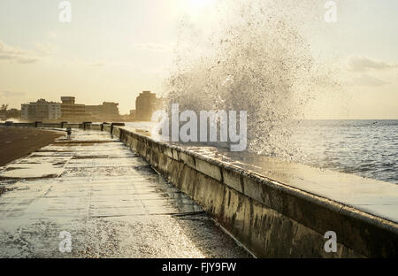 water splashing over the pier in havana, Cuba Stock Photo