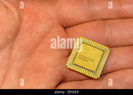 One vintage ceramic CPU in the hand Stock Photo