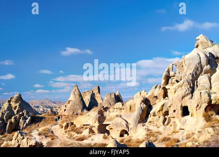 Eroded volcanic tuff early Christian troglodyte cave dwelling rooms in Goreme Open Air Museum National Park, Cappadocia, Turkey Stock Photo