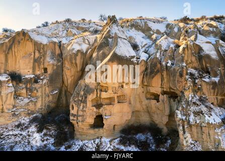 Eroded volcanic tuff early Christian troglodyte cave dwelling rooms in Goreme Open Air Museum National Park, Cappadocia, Turkey Stock Photo