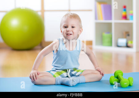 happy child little boy goes in for sports Stock Photo