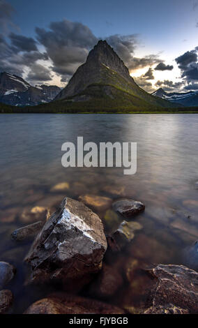 Beauty of sunset on Swifcurrent Lake, Glacier National Park Stock Photo