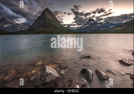 Beauty of sunset on Swifcurrent Lake, Glacier National Park Stock Photo