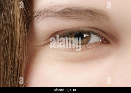 smiling young woman green-brown hazel eye closeup photo Stock Photo