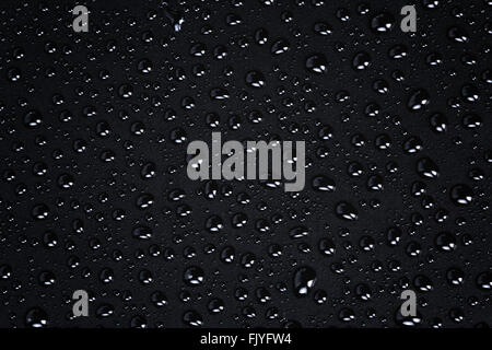 water drops on a black plastic surface Stock Photo