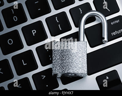 open security lock on computer keyboard - computer security breach concept Stock Photo