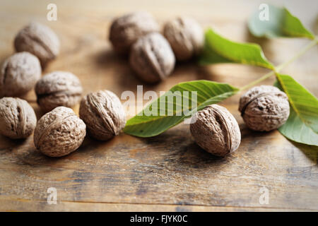 Walnuts on wooden table Stock Photo