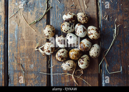 Quail eggs on wooden table Stock Photo