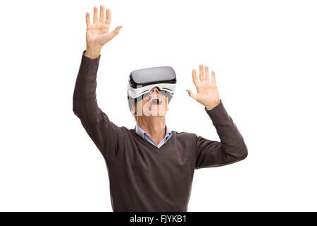 Studio shot of a senior man using a VR headset isolated on white background Stock Photo