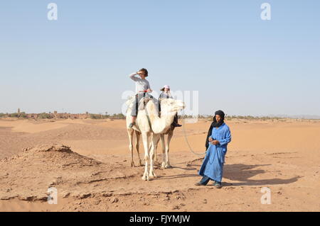 Camel riding in Sahara, South Morocco Stock Photo