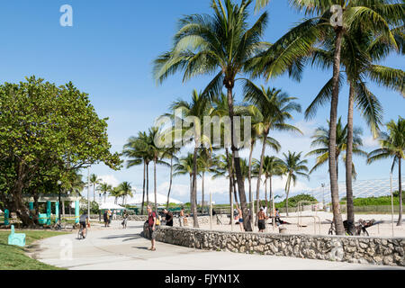 People walking on South Beach Boardwalk in Miami Beach, Florida, USA Stock Photo